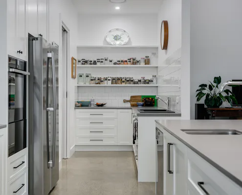 Butlers Pantry in Encounter Bay Butlers pantry with white shelving above white drawers and lower cupboards